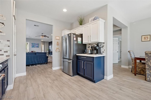 2425 Sturrock Dr, Henderson, NV 89044 - kitchen featuring freestanding refrigerator, white cabinets, a ceiling fan, light countertops, and recessed lighting