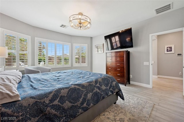 2425 Sturrock Dr, Henderson, NV 89044 - bedroom featuring a chandelier, baseboards, and light wood-type flooring
