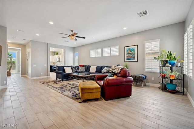 2425 Sturrock Dr, Henderson, NV 89044 - living room with healthy amount of natural light, baseboards, light wood-style flooring, ceiling fan, and recessed lighting