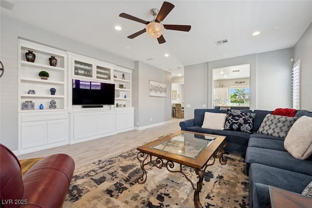 2425 Sturrock Dr, Henderson, NV 89044 - living room with ceiling fan, light wood-style flooring, recessed lighting, and built in shelves
