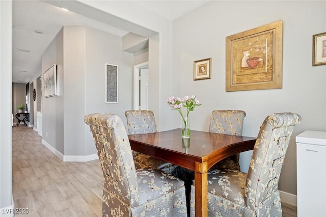 2425 Sturrock Dr, Henderson, NV 89044 - dining area featuring light wood-style flooring and baseboards