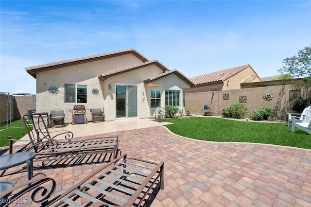 2425 Sturrock Dr, Henderson, NV 89044 - rear view of property featuring stucco siding and a patio area