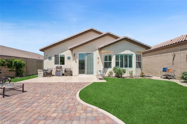 2425 Sturrock Dr, Henderson, NV 89044 - back of property featuring stucco siding and a patio