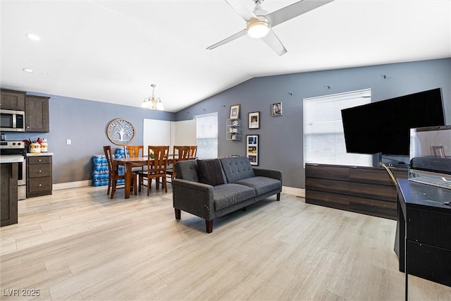320 W Van Buren Ave, Las Vegas, NV 89106 - living area featuring light wood-style flooring, lofted ceiling, a chandelier, ceiling fan, and baseboards