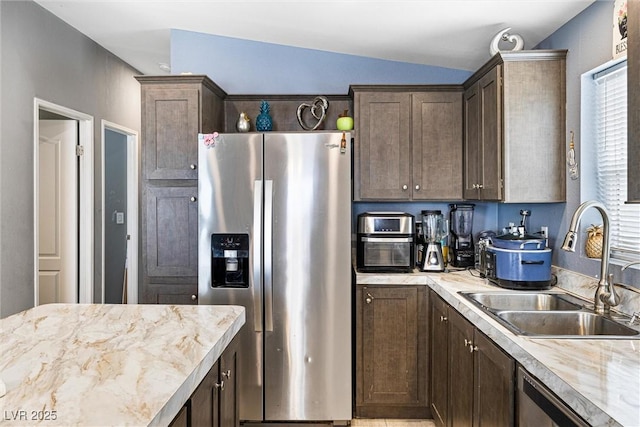 320 W Van Buren Ave, Las Vegas, NV 89106 - kitchen with stainless steel appliances, a sink, dark brown cabinetry, and vaulted ceiling