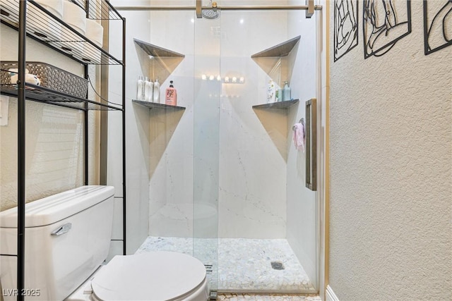 320 W Van Buren Ave, Las Vegas, NV 89106 - bathroom with toilet, a marble finish shower, and a textured wall