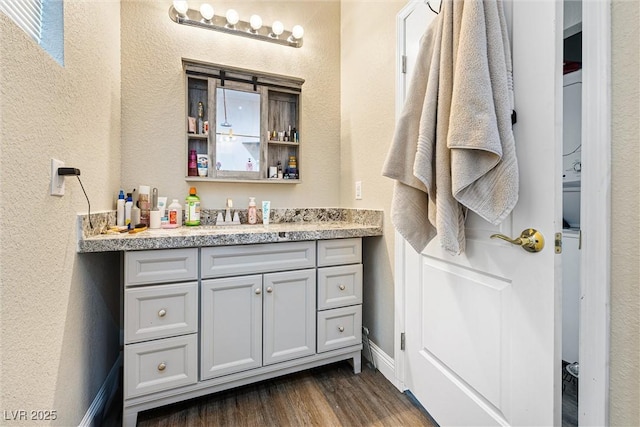 320 W Van Buren Ave, Las Vegas, NV 89106 - bathroom with wood finished floors, vanity, and a textured wall
