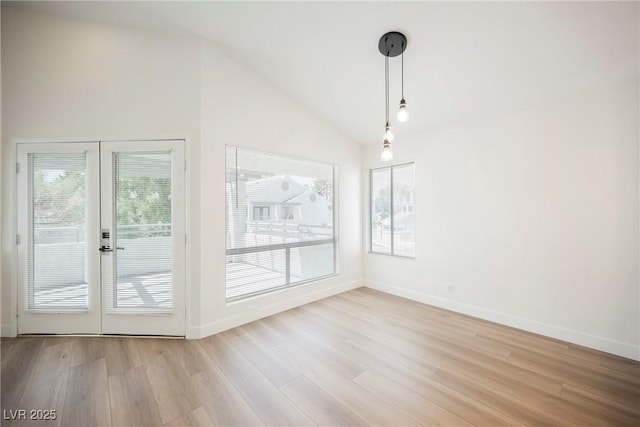 5516 Orchard Ln Unit 0, Las Vegas, NV 89110 - unfurnished dining area featuring plenty of natural light, french doors, wood finished floors, and lofted ceiling