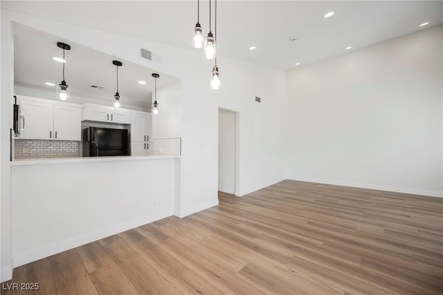 5516 Orchard Ln Unit 0, Las Vegas, NV 89110 - unfurnished living room featuring wood finished floors, recessed lighting, and baseboards