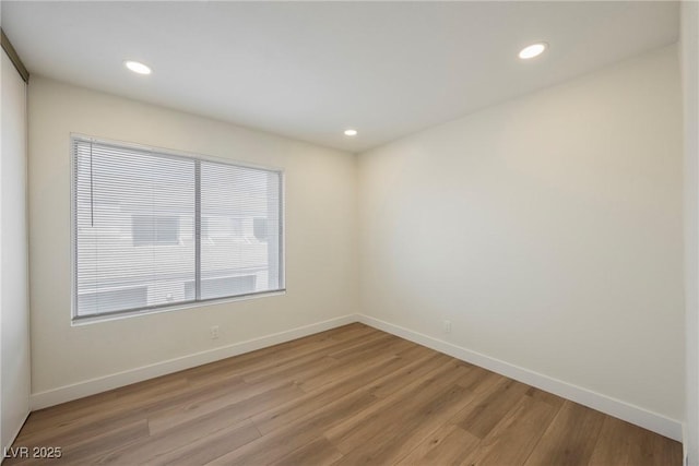5516 Orchard Ln Unit 0, Las Vegas, NV 89110 - spare room featuring light wood-type flooring, baseboards, and recessed lighting