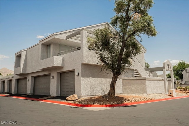 5516 Orchard Ln Unit 0, Las Vegas, NV 89110 - view of front of property with stucco siding and an attached garage
