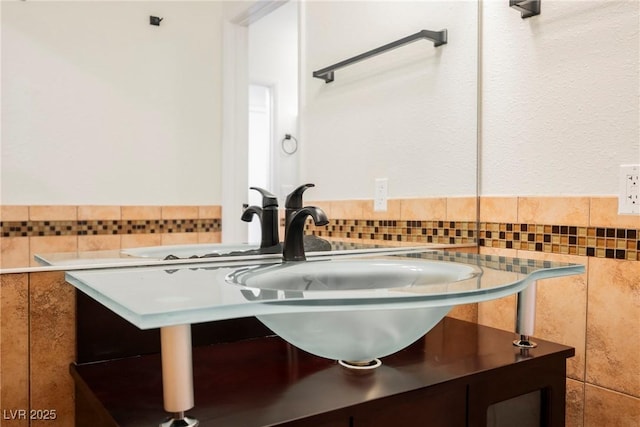 5516 Orchard Ln Unit 0, Las Vegas, NV 89110 - bathroom with tile walls, vanity, and a wainscoted wall