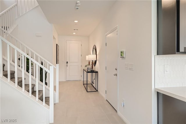 9588 Archer Peak Ct, Las Vegas, NV 89143 - entrance foyer with stairway, recessed lighting, baseboards, and light flooring