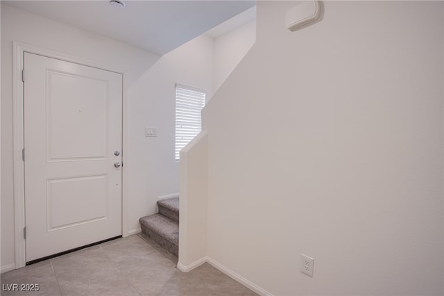 6288 Dolosonte St, Las Vegas, NV 89113 - entryway with stairway, baseboards, and light tile patterned floors