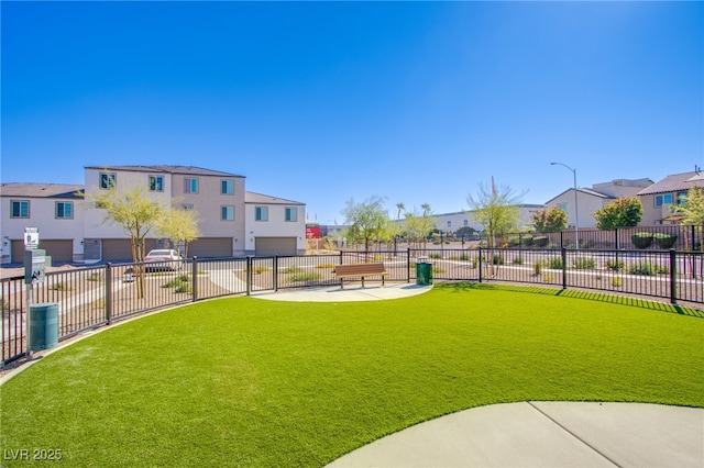 6288 Dolosonte St, Las Vegas, NV 89113 - view of yard featuring a residential view, a garage, and driveway