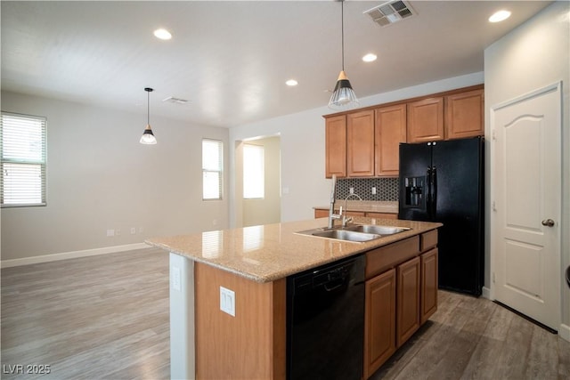 7715 Peaceful Trellis Dr, Las Vegas, NV 89179 - kitchen with black appliances, a sink, plenty of natural light, light wood-style floors, and recessed lighting