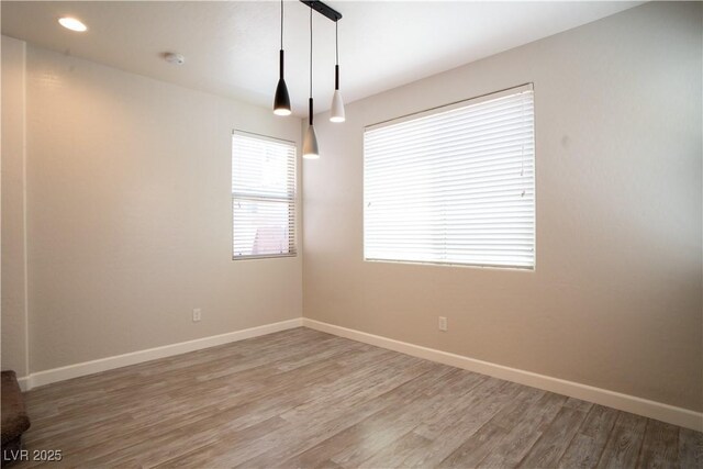 7715 Peaceful Trellis Dr, Las Vegas, NV 89179 - spare room with wood finished floors, baseboards, and a smoke detector