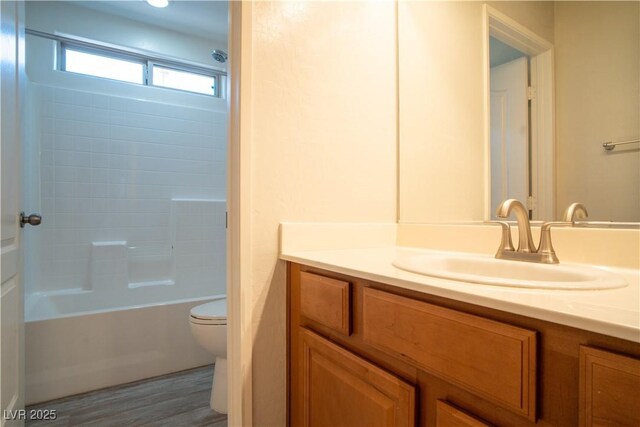 7715 Peaceful Trellis Dr, Las Vegas, NV 89179 - bathroom with vanity, toilet, washtub / shower combination, and wood finished floors