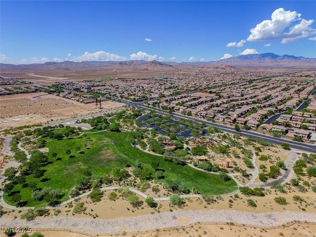 7715 Peaceful Trellis Dr, Las Vegas, NV 89179 - aerial perspective of suburban area with a mountainous background