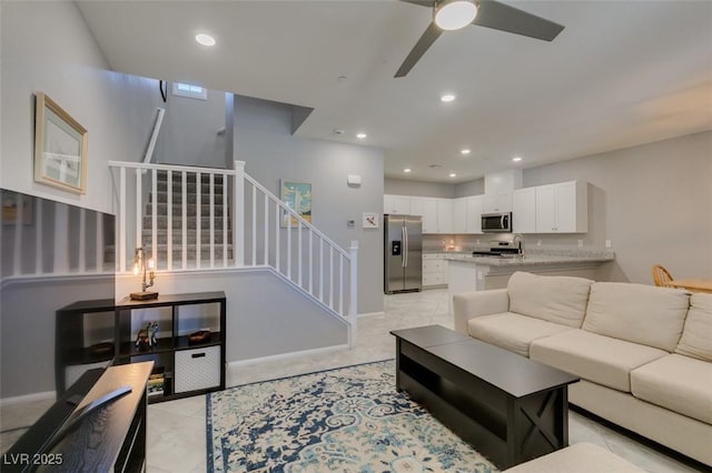 2870 Turnstone Ridge St, Henderson, NV 89044 - living room with stairs, a ceiling fan, recessed lighting, light tile patterned floors, and baseboards