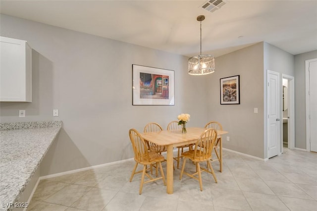 2870 Turnstone Ridge St, Henderson, NV 89044 - dining space featuring a chandelier, light tile patterned flooring, and baseboards