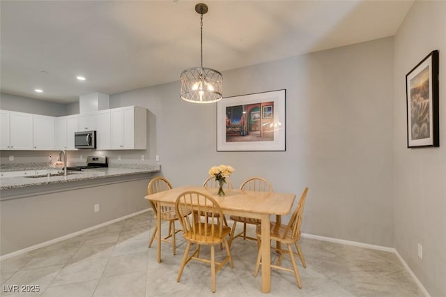 2870 Turnstone Ridge St, Henderson, NV 89044 - dining area featuring a chandelier, baseboards, recessed lighting, and light tile patterned flooring