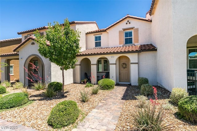 2870 Turnstone Ridge St, Henderson, NV 89044 - mediterranean / spanish house featuring a tile roof and stucco siding