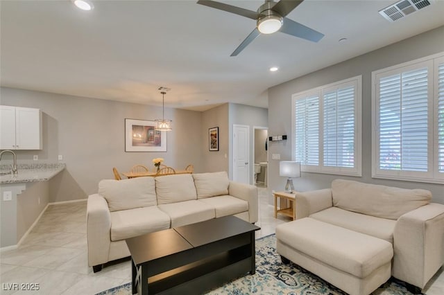 2870 Turnstone Ridge St, Henderson, NV 89044 - living area featuring recessed lighting, a ceiling fan, light tile patterned flooring, and baseboards