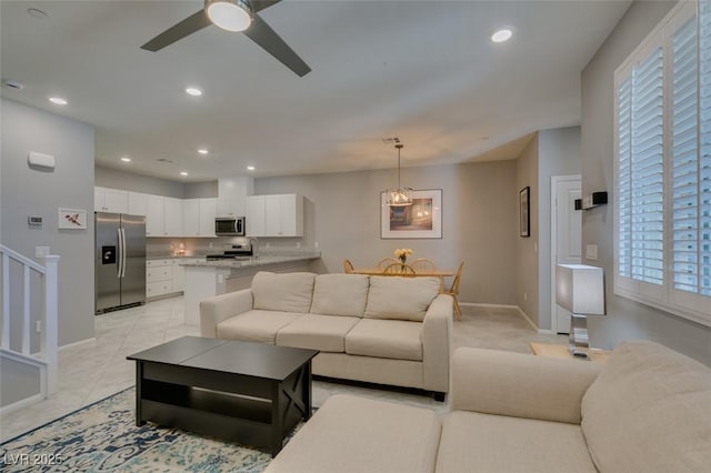 2870 Turnstone Ridge St, Henderson, NV 89044 - living area with ceiling fan, baseboards, recessed lighting, and stairway