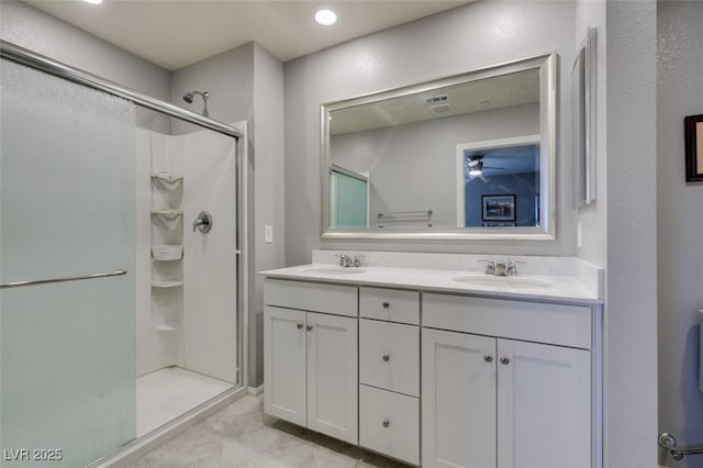 2870 Turnstone Ridge St, Henderson, NV 89044 - bathroom featuring a stall shower, double vanity, and ceiling fan