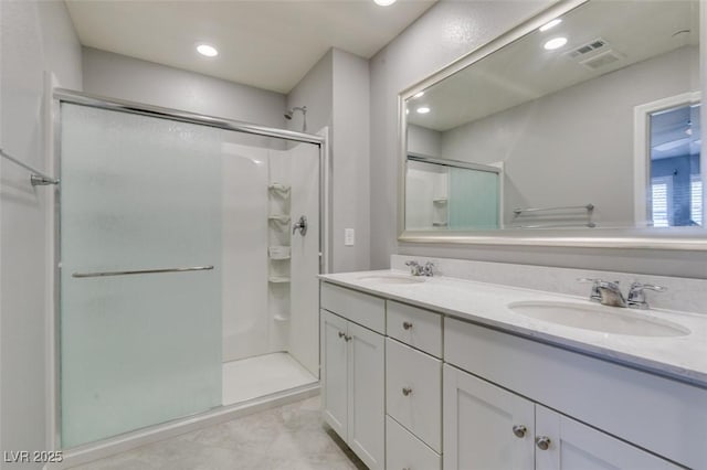 2870 Turnstone Ridge St, Henderson, NV 89044 - bathroom with a stall shower, double vanity, and recessed lighting