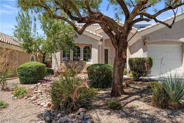 2158 Shubert Ave, Henderson, NV 89052 - view of front facade with a garage, stucco siding, and a tiled roof
