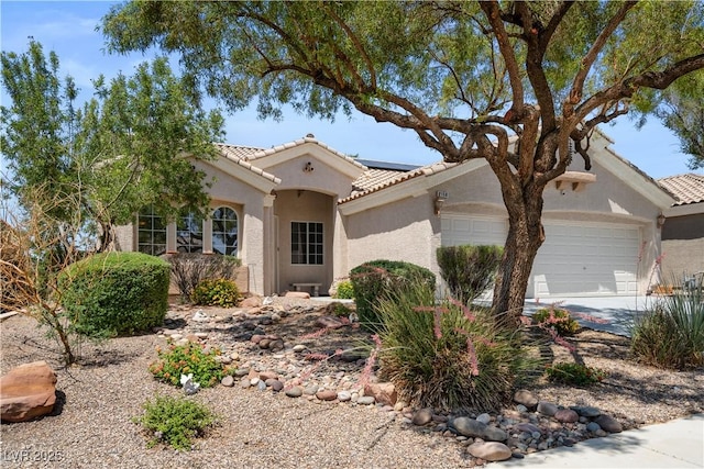 2158 Shubert Ave, Henderson, NV 89052 - view of front facade with a garage, a tiled roof, stucco siding, and solar panels