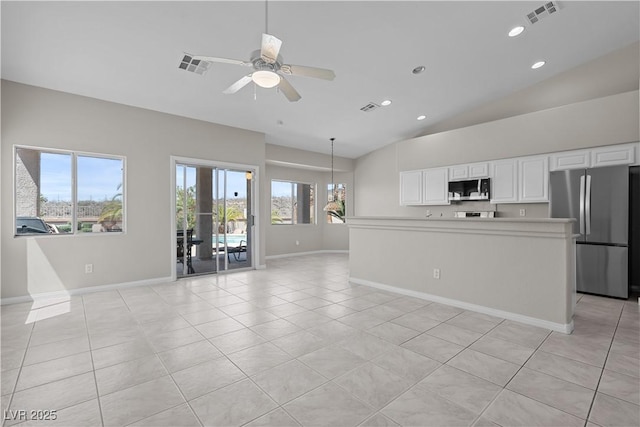 2158 Shubert Ave, Henderson, NV 89052 - kitchen with appliances with stainless steel finishes, lofted ceiling, baseboards, a ceiling fan, and light tile patterned floors