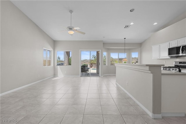 2158 Shubert Ave, Henderson, NV 89052 - unfurnished living room with light tile patterned floors, ceiling fan, baseboards, and recessed lighting