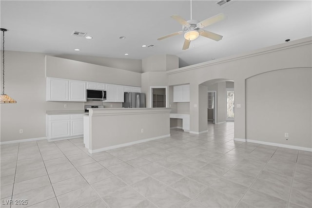 2158 Shubert Ave, Henderson, NV 89052 - unfurnished living room with arched walkways, a ceiling fan, baseboards, recessed lighting, and high vaulted ceiling