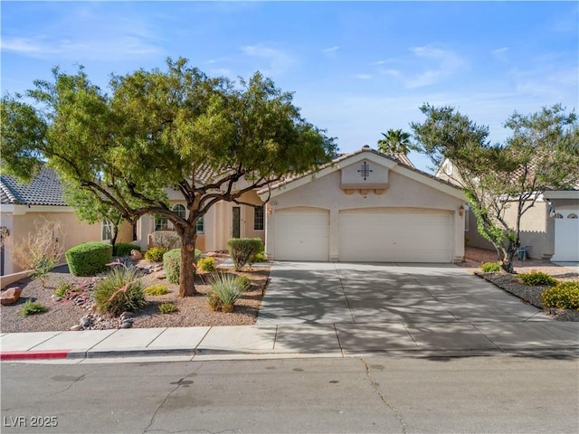 2158 Shubert Ave, Henderson, NV 89052 - view of front facade with an attached garage, stucco siding, and driveway