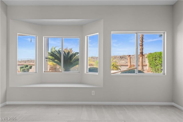 2158 Shubert Ave, Henderson, NV 89052 - unfurnished room featuring light carpet, baseboards, and plenty of natural light