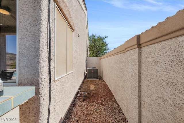 2158 Shubert Ave, Henderson, NV 89052 - view of side of home with stucco siding and central AC unit