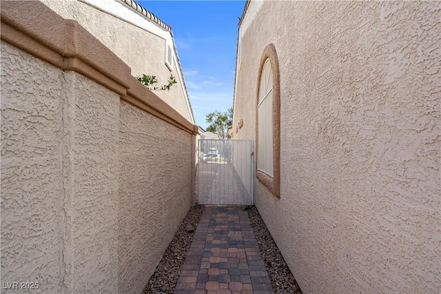 2158 Shubert Ave, Henderson, NV 89052 - view of home's exterior with stucco siding and a gate