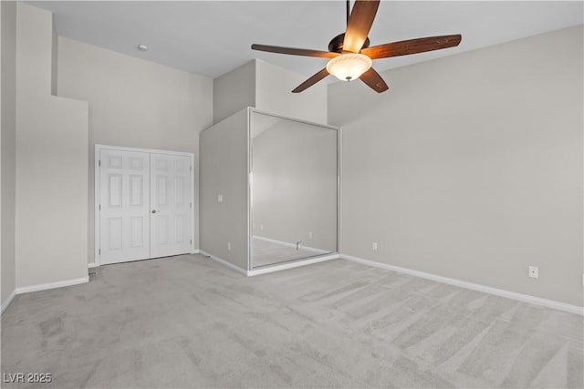 2158 Shubert Ave, Henderson, NV 89052 - unfurnished bedroom featuring carpet flooring, baseboards, a ceiling fan, a closet, and a high ceiling