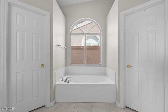 2158 Shubert Ave, Henderson, NV 89052 - bathroom featuring a garden tub, baseboards, and tile patterned flooring