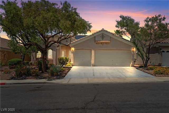 2158 Shubert Ave, Henderson, NV 89052 - view of front facade featuring concrete driveway, an attached garage, stucco siding, and a tile roof