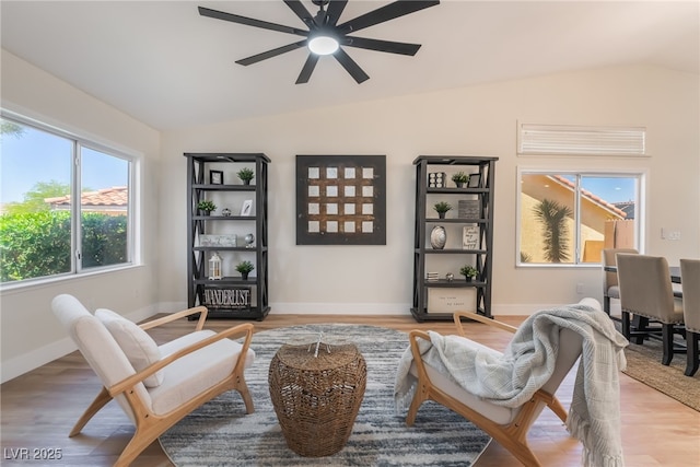 9705 Standard Ave, Las Vegas, NV 89129 - sitting room featuring vaulted ceiling, a ceiling fan, light wood finished floors, and baseboards
