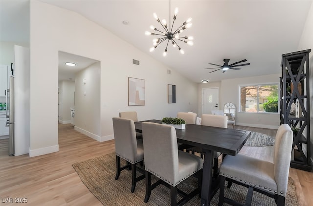 9705 Standard Ave, Las Vegas, NV 89129 - dining room with vaulted ceiling, a chandelier, light wood-type flooring, baseboards, and a ceiling fan