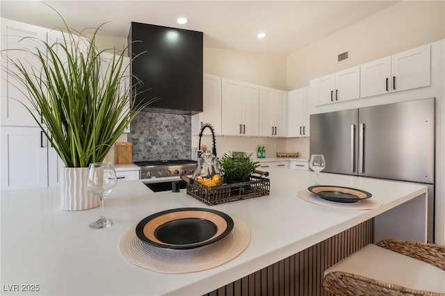 9705 Standard Ave, Las Vegas, NV 89129 - kitchen featuring white cabinetry, a breakfast bar, light countertops, and recessed lighting