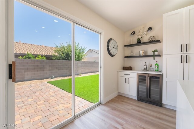 9705 Standard Ave, Las Vegas, NV 89129 - indoor wet bar featuring wine cooler and light wood-style floors