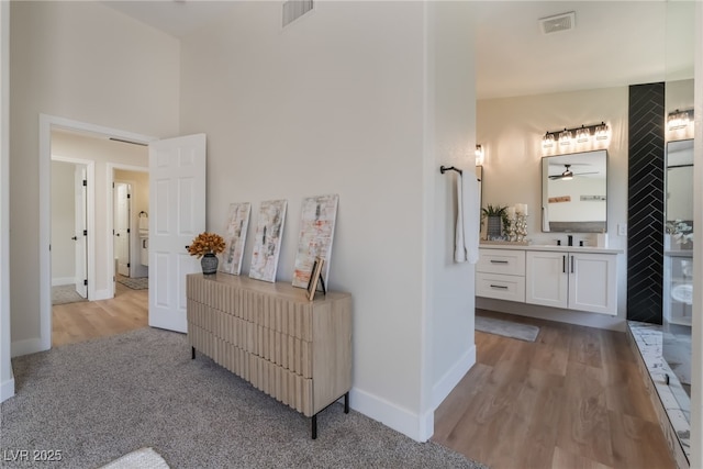 9705 Standard Ave, Las Vegas, NV 89129 - corridor with baseboards, wood finished floors, and carpet flooring