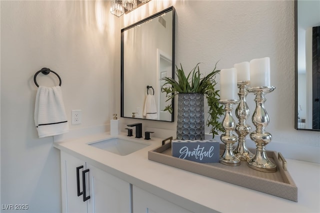 9705 Standard Ave, Las Vegas, NV 89129 - bathroom featuring vanity and a chandelier