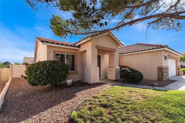 9705 Standard Ave, Las Vegas, NV 89129 - mediterranean / spanish house featuring stucco siding, an attached garage, and a tiled roof